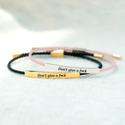 Bracelet with 'Don't give a f*ck' message on a light background